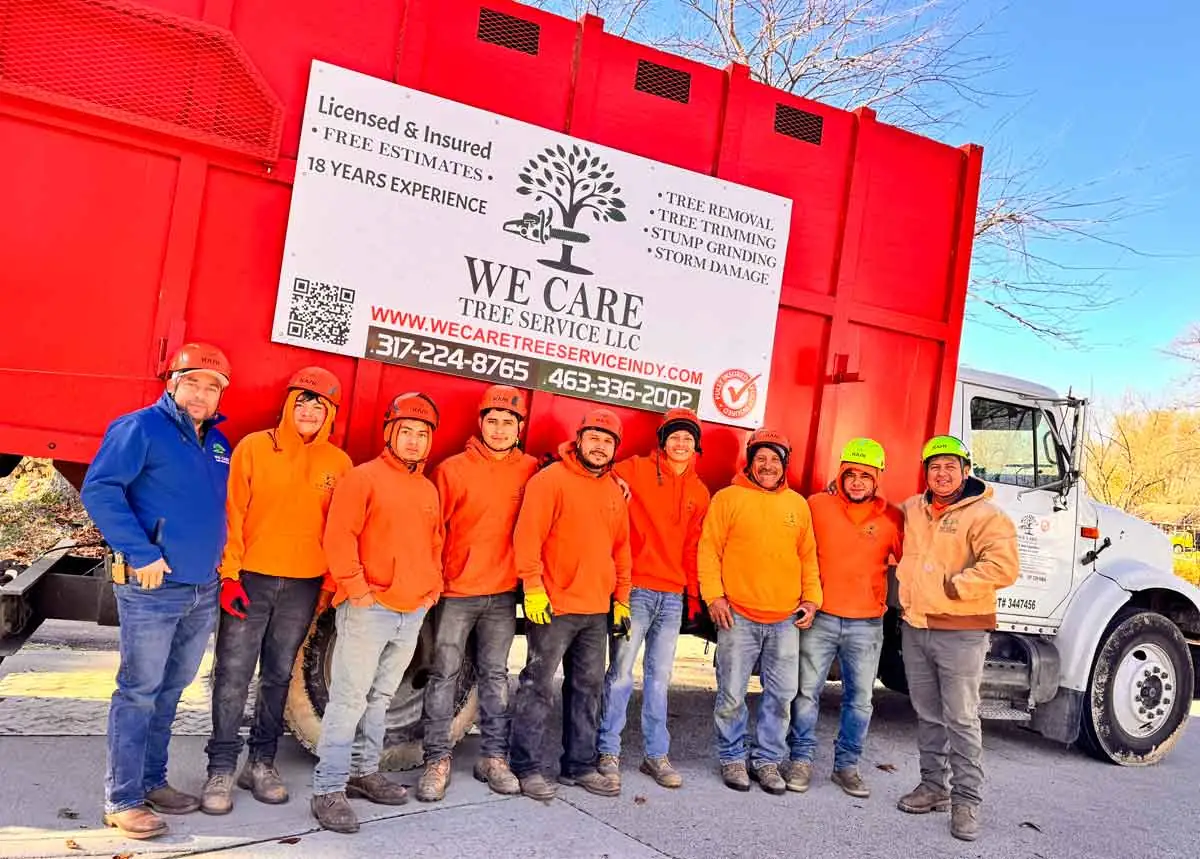 We Care Tree Service crew lined up beside their truck in Indianapolis